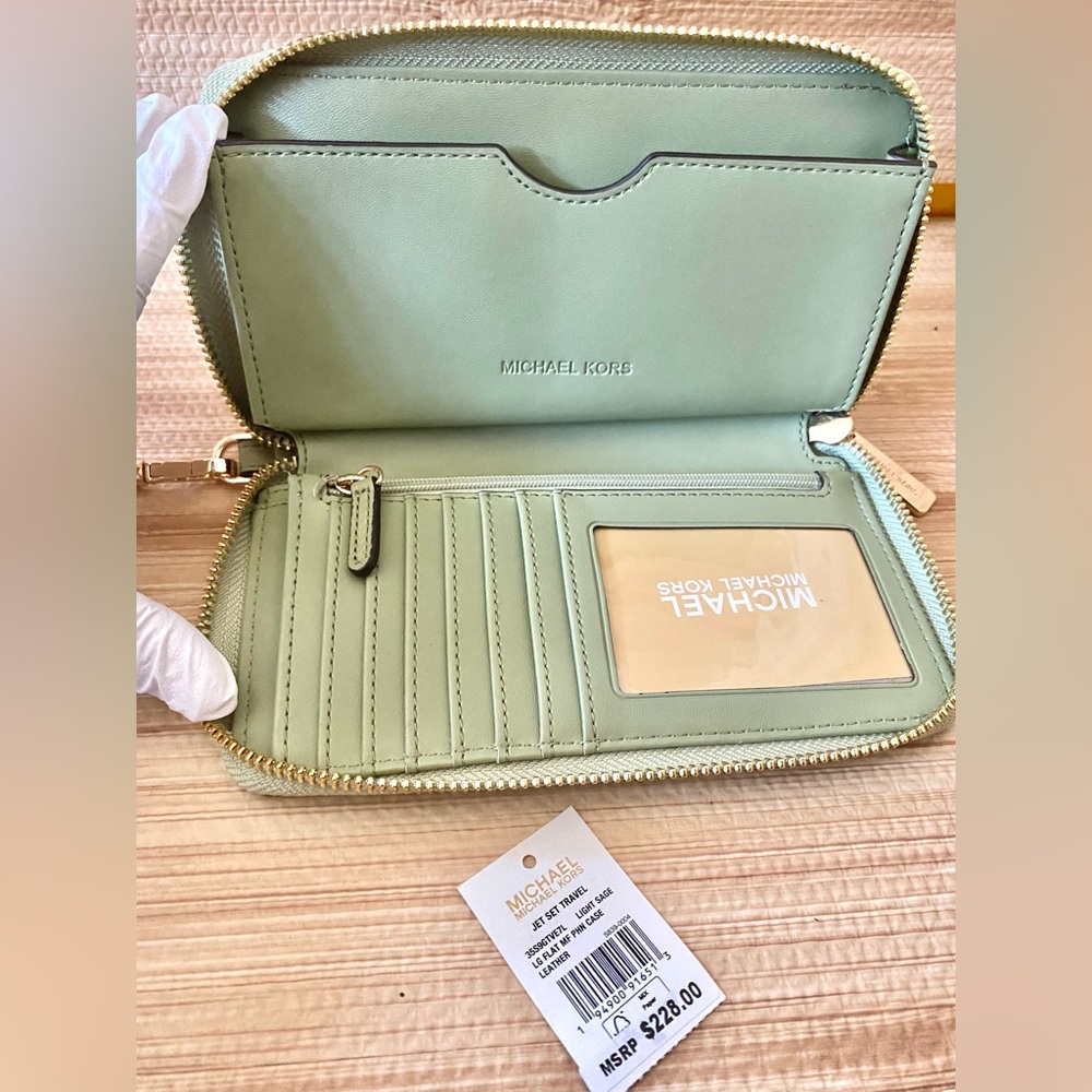 SOLD OUT Michael Kors Jet Set Multi-function Phone Holder/Wristlet/Wallet.